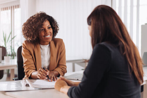 Woman consulting with a female financial manager at the bank