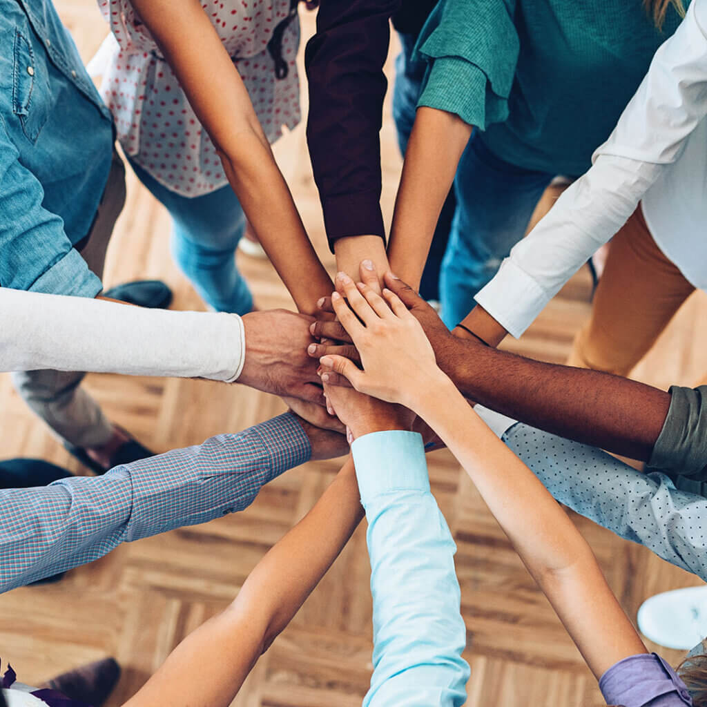 Group with hands in together