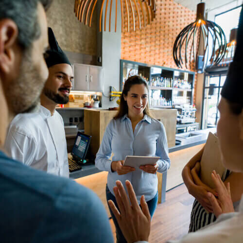 Small business restaurant owner with staff