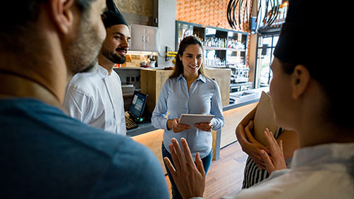 Small business restaurant owner with staff