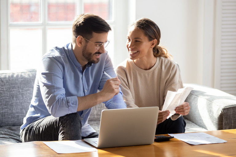 Couple discussing savings habits together