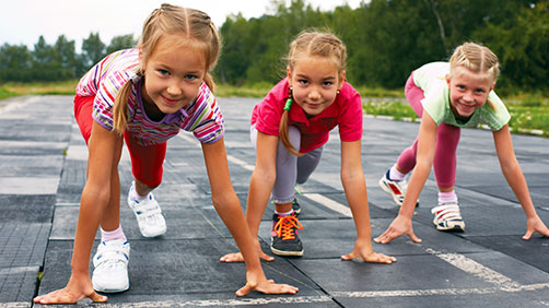 three girls at a running track